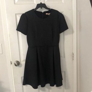 Black Aline dress with pockets on each side.